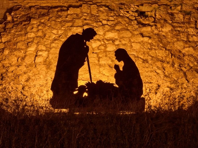 Silhouette of the nativity scene at sunset, symbolizing hope and the true meaning of Christmas in solitude.